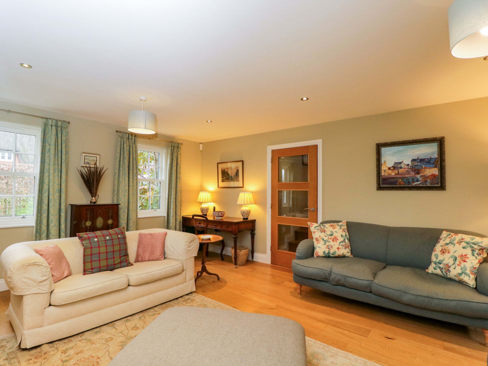 A living room with furniture and decor at Ormiston House in Netheravon