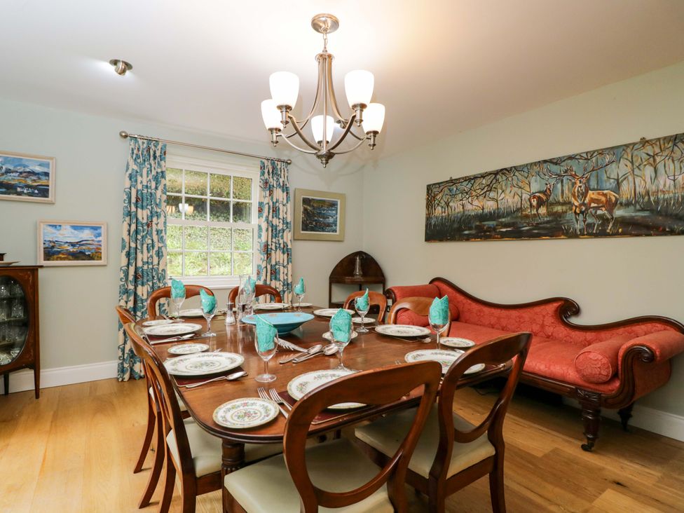 A dining room with a table set for dinner at Ormiston House in Netheravon