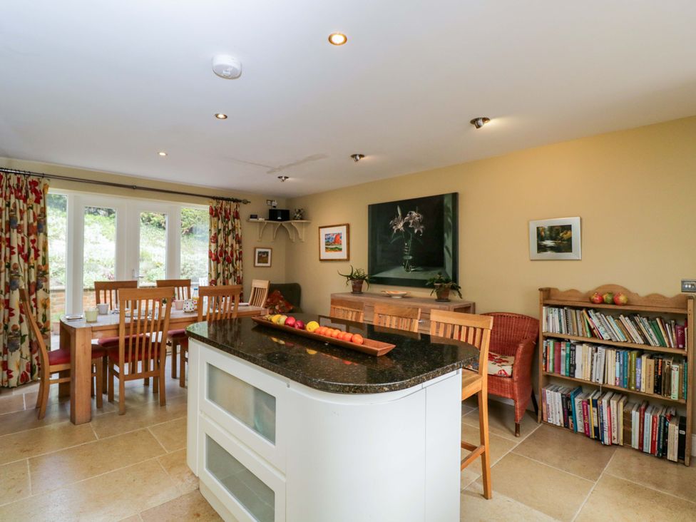 A kitchen with a dining table and chairs at Ormiston House in Netheravon
