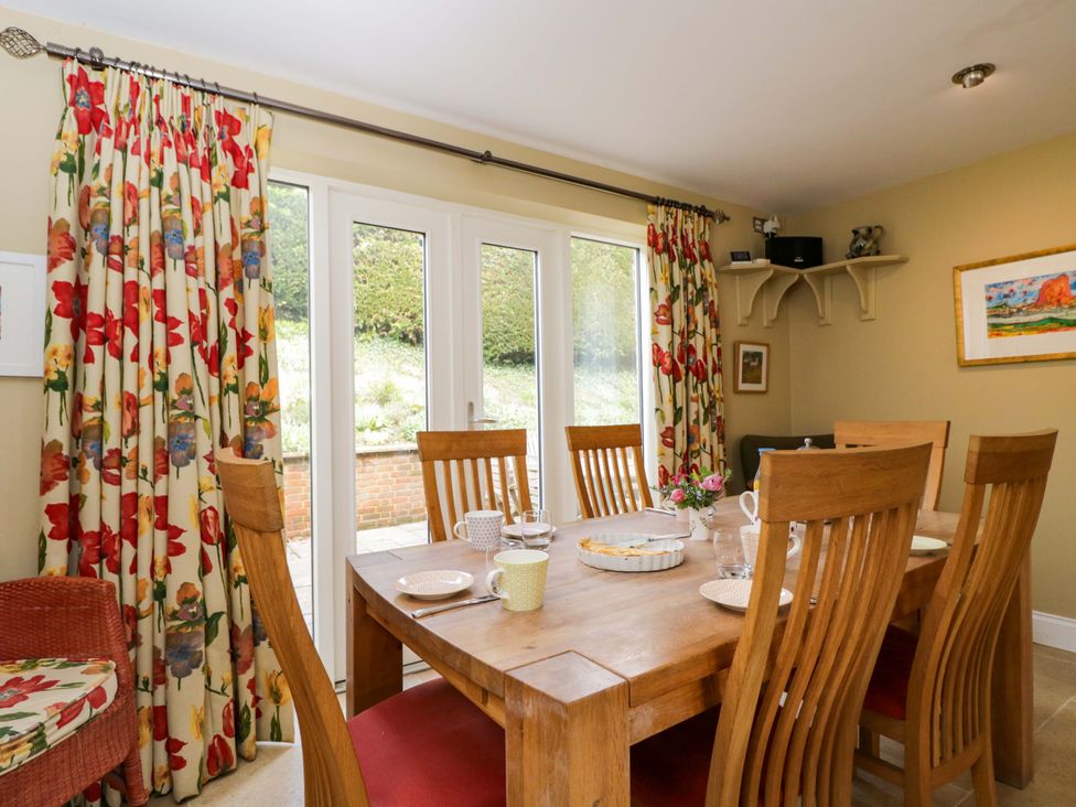 A dining room with a table and chairs at Ormiston House in Netheravon