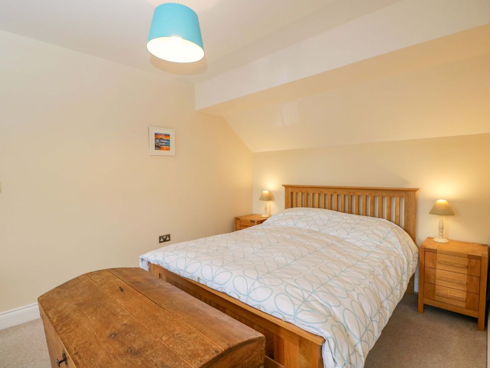 A bedroom with a bed and bedside tables at Ormiston House Netheravon
