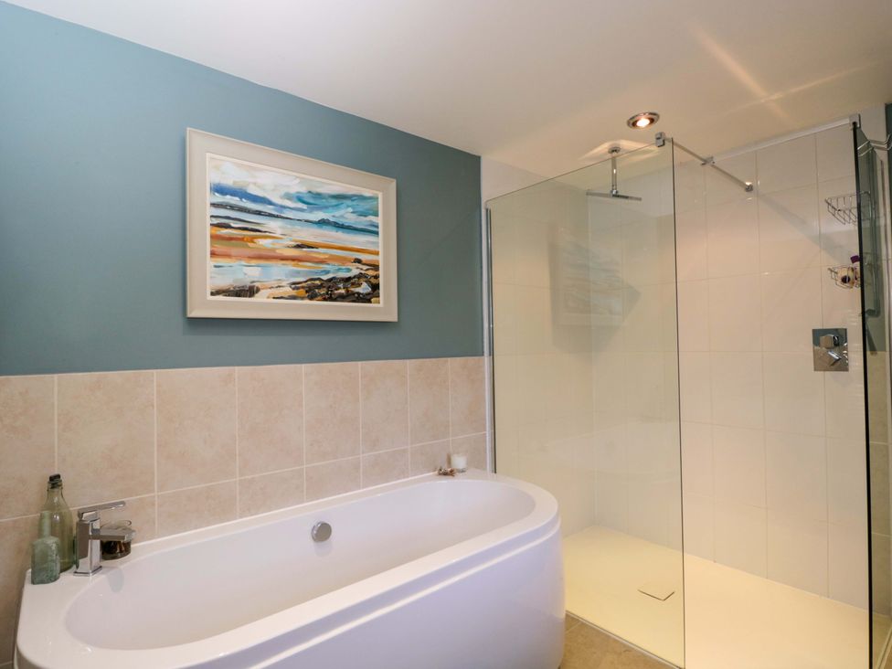 A bathroom with a bathtub and shower at Ormiston House in Netheravon