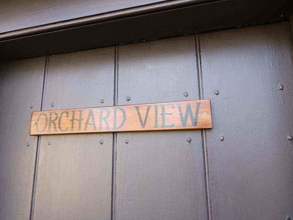 A sign that reads Orchard View on a door at Orchard View in Oakerthorpe