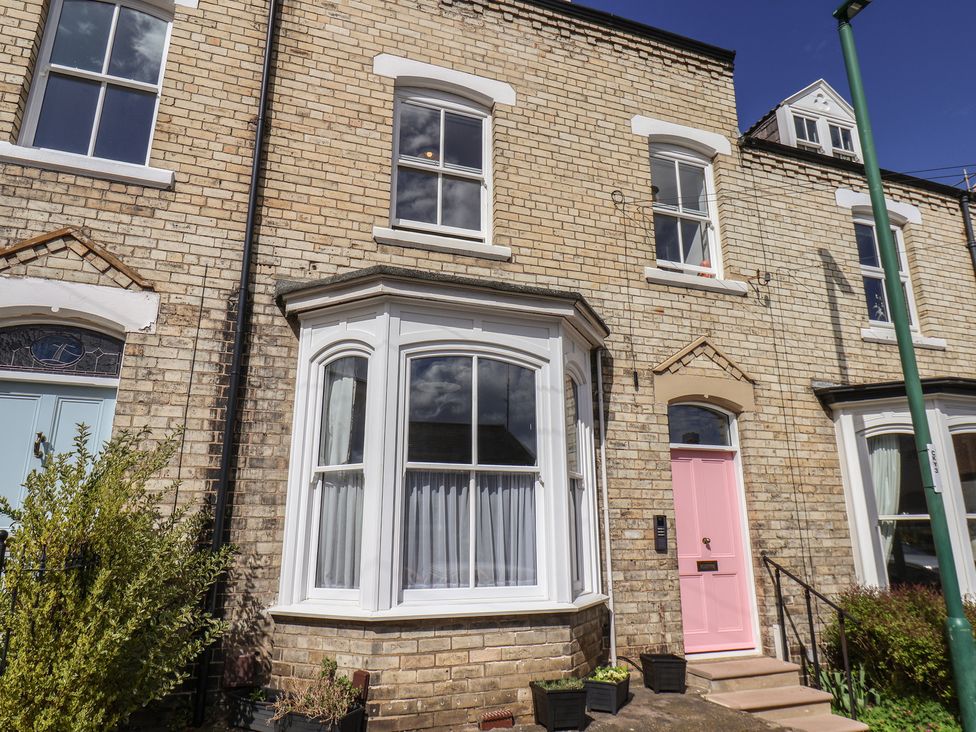 A house exterior with a pink front door at Nancy’s Blushes in Saltburn-by-the-Sea