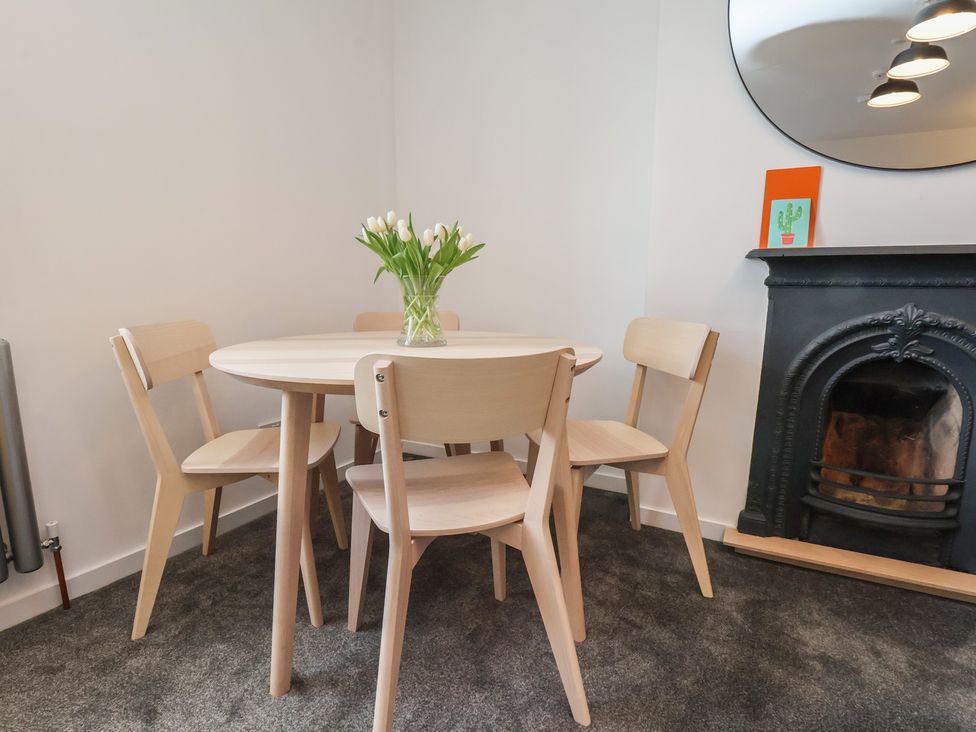 A dining room with a table and chairs at Nancy’s Blushes in Saltburn-by-the-Sea
