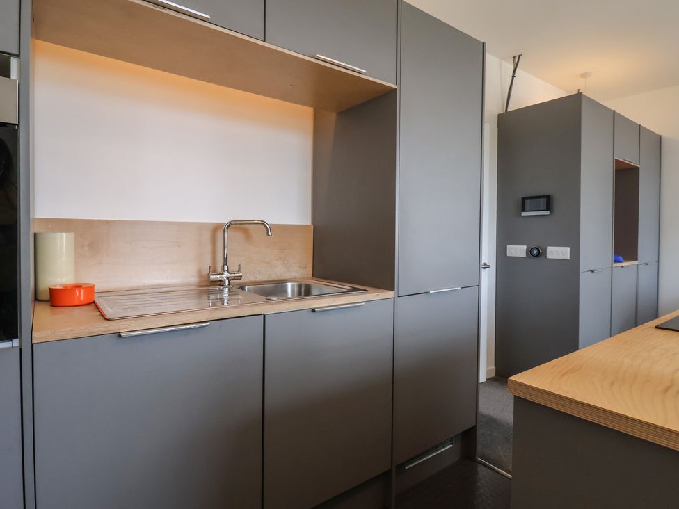 A kitchen with a sink and cabinetry at Nancy’s Blushes in Saltburn-by-the-Sea