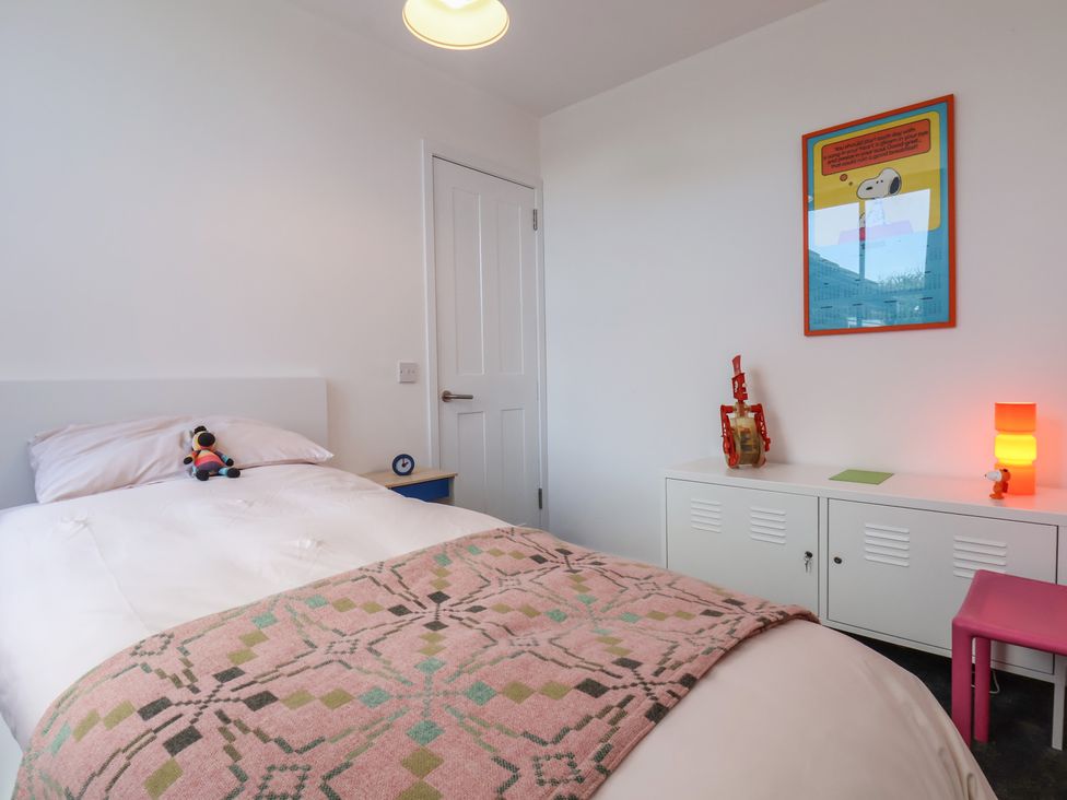 A bedroom with a bed and a toy on the pillow at Nancy’s Blushes in Saltburn-by-the-Sea