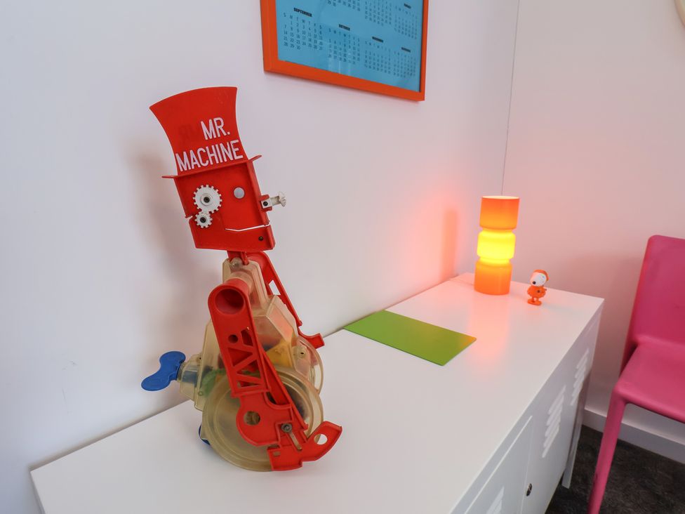 A playroom with a Mr. Machine toy and colorful lamp at Nancy’s Blushes in Saltburn-by-the-Sea