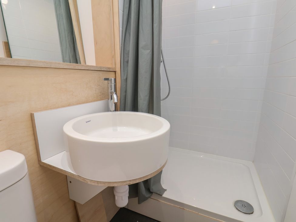 A bathroom with a sink and shower at Nancy’s Blushes, Saltburn-by-the-Sea