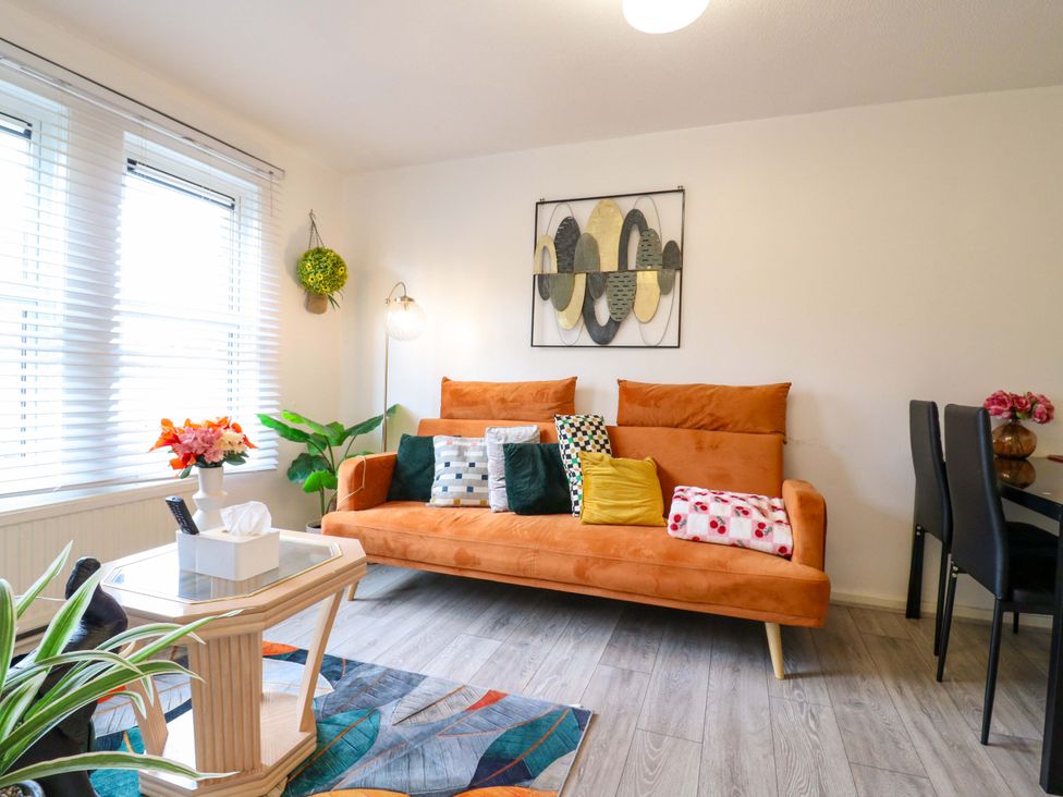 A living room with a sofa and coffee table at 22A Warrender Road, Tufnell Park