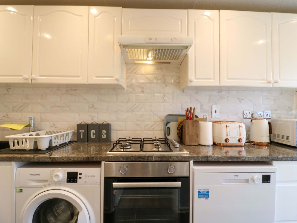 A kitchen with appliances and cabinets at 22A Warrender Road in Tufnell Park