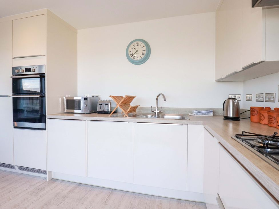 A kitchen with appliances and a sink at Serfaus in Perranporth