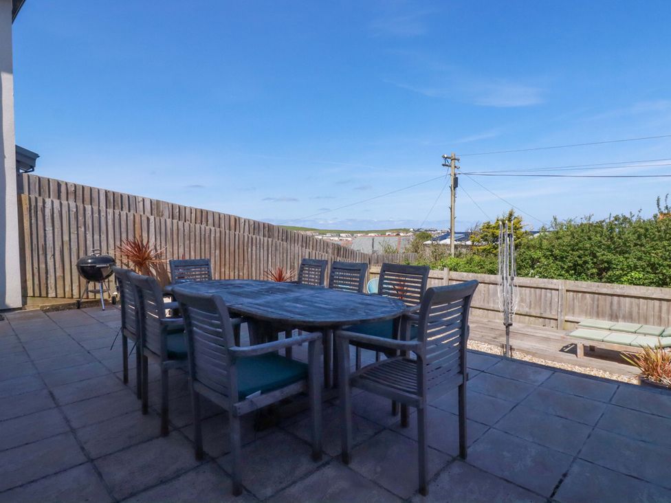A patio with a table and chairs at Serfaus in Perranporth