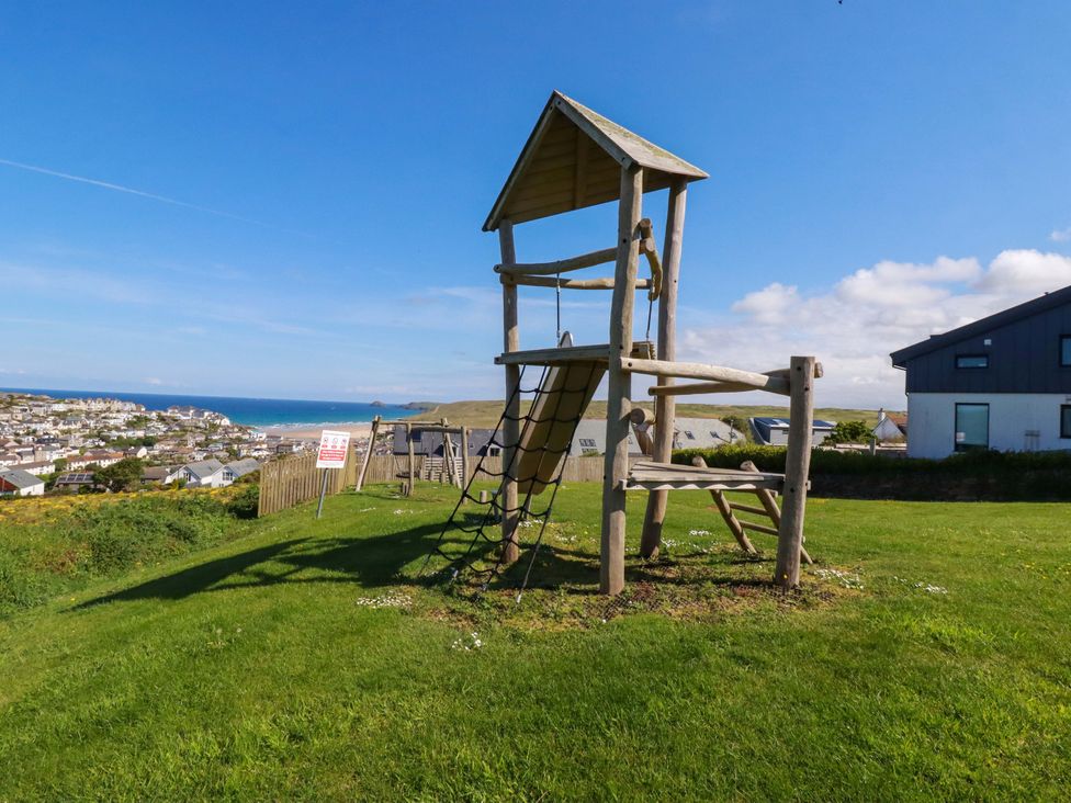 A play structure with climbing frame and slide at Serfaus in Perranporth