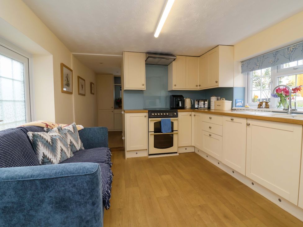 A kitchen with an oven and a sink at The Apple Loft in Exeter