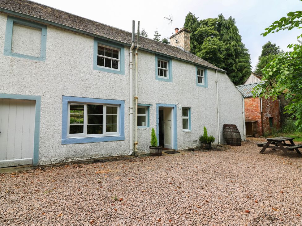 A house with windows and a door in Gardener’s cottage Stanley