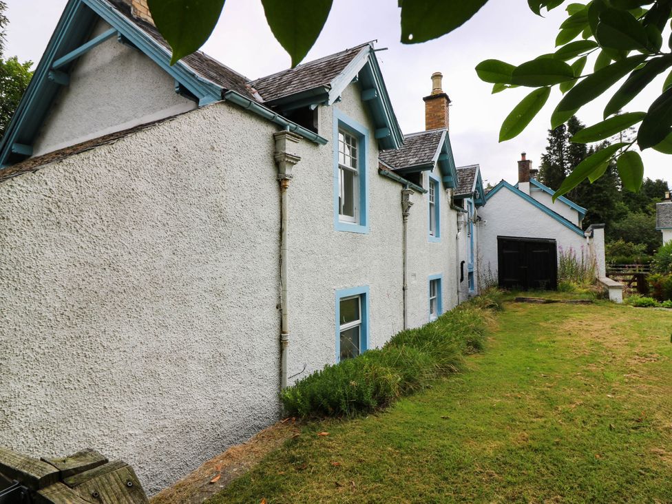 A house exterior with windows and garden at Gardener’s cottage Stanley