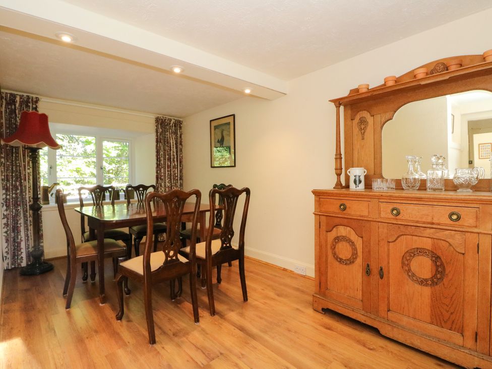 A dining room with table and chairs at Gardener’s cottage in Stanley