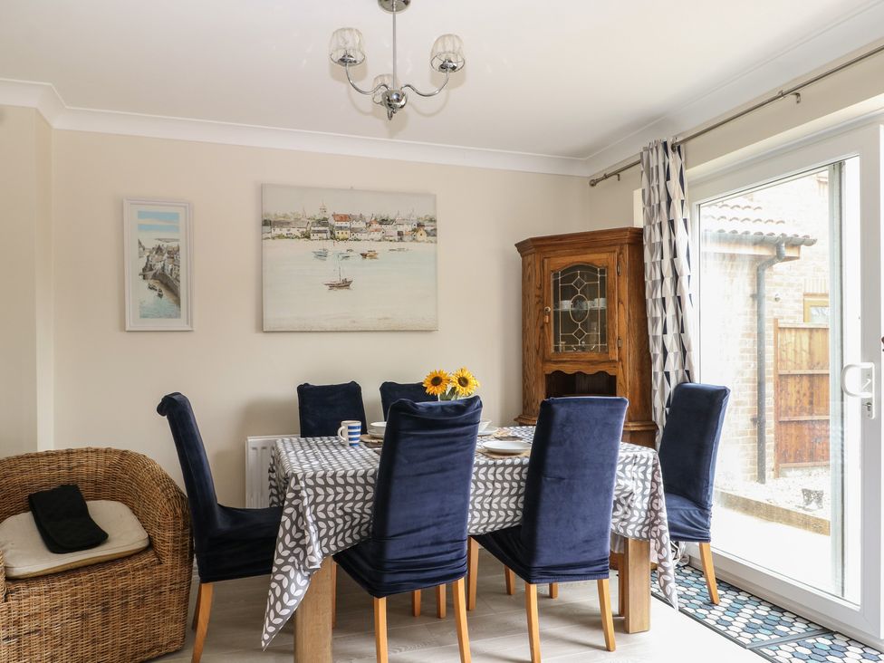 A dining room with a table and chairs at The Willows 
