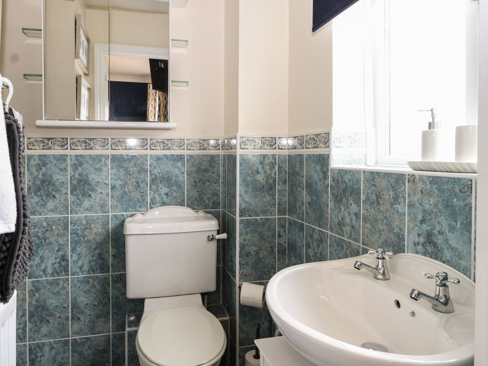A bathroom with a toilet and sink at The Willows