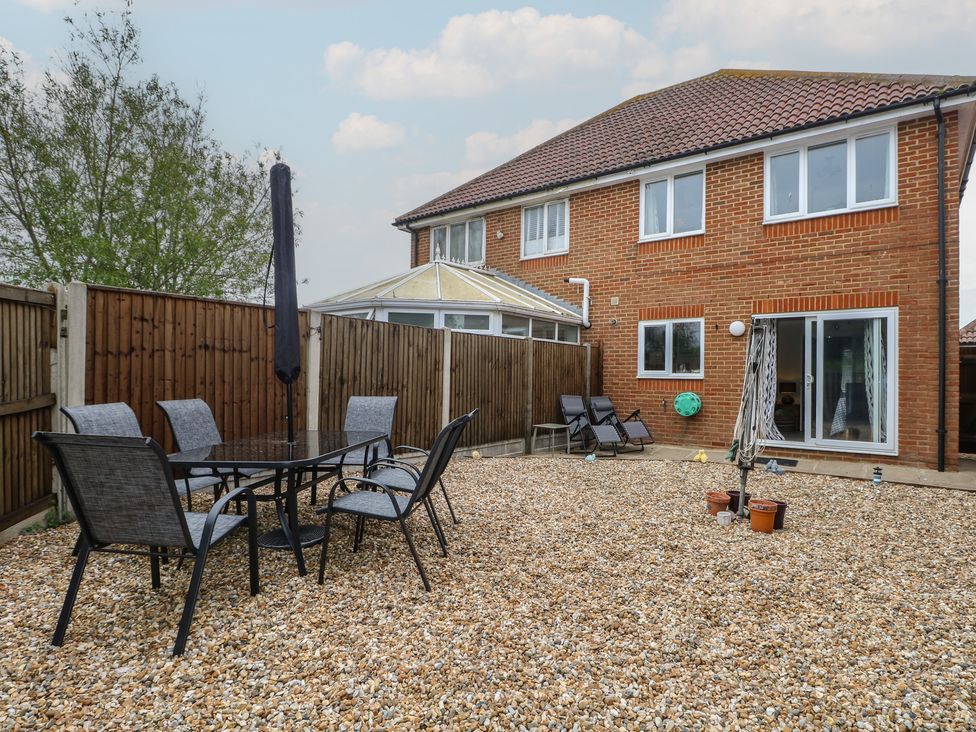 A garden with table and chairs at The Willows