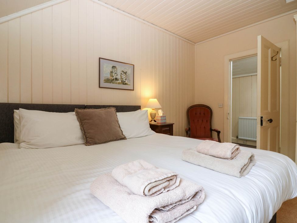 A bedroom with a bed and towels arranged at West House in Perth