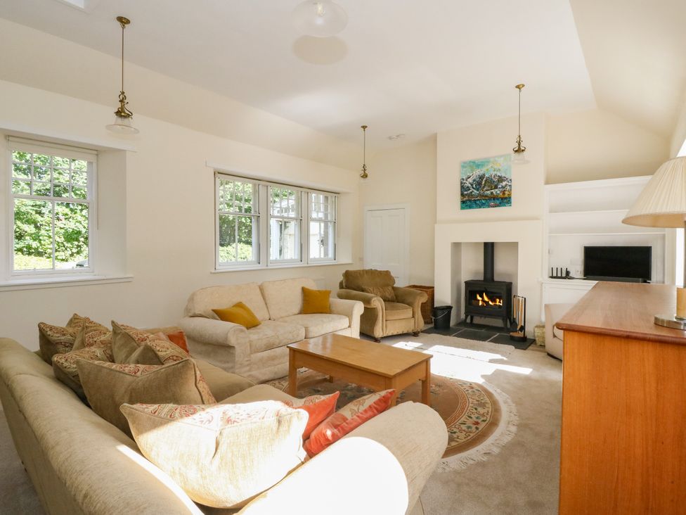 A living room with sofas and a fireplace at West House in Stanley