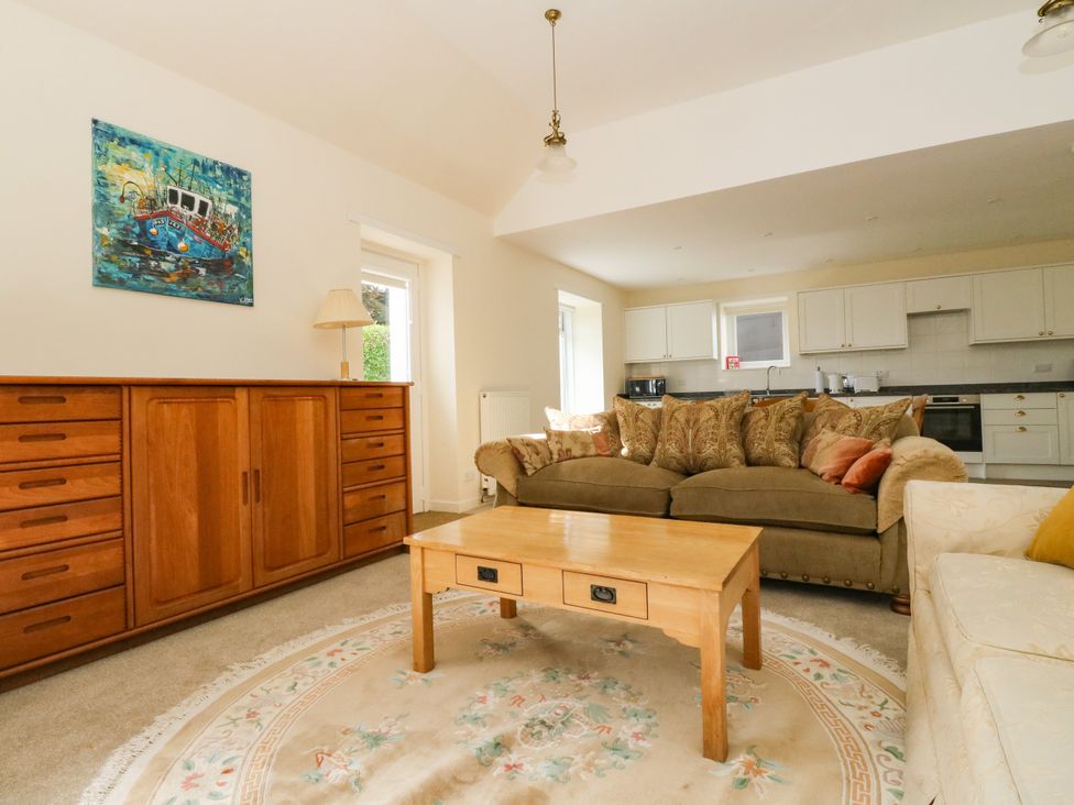 A living room with a sofa and coffee table at West House in Stanley