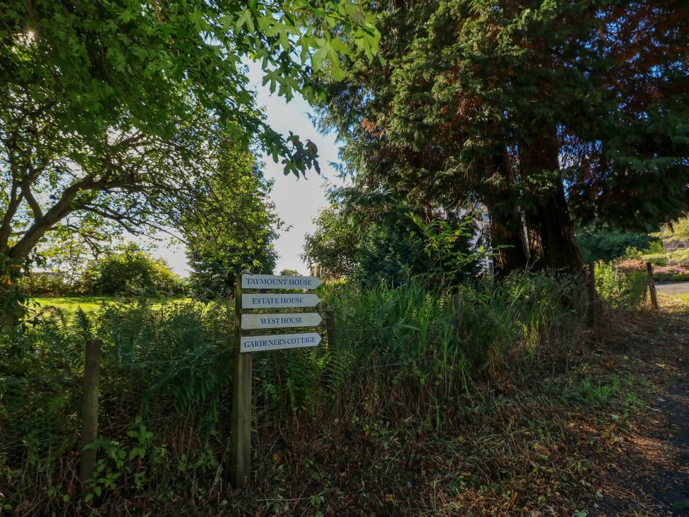 A signpost indicating locations at West House in Stanley