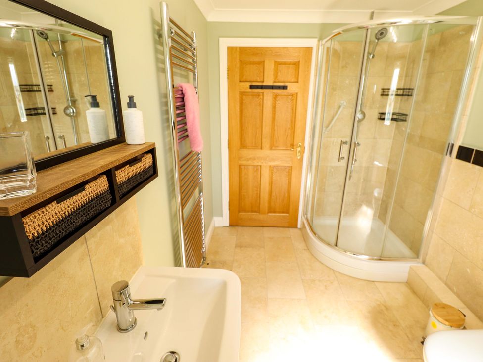 A bathroom featuring a shower and sink at Rowan Cottage in Boston
