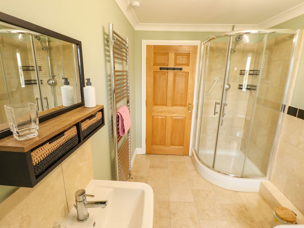 A bathroom with a shower and sink at Rowan Cottage in Mareham-Le-Fen