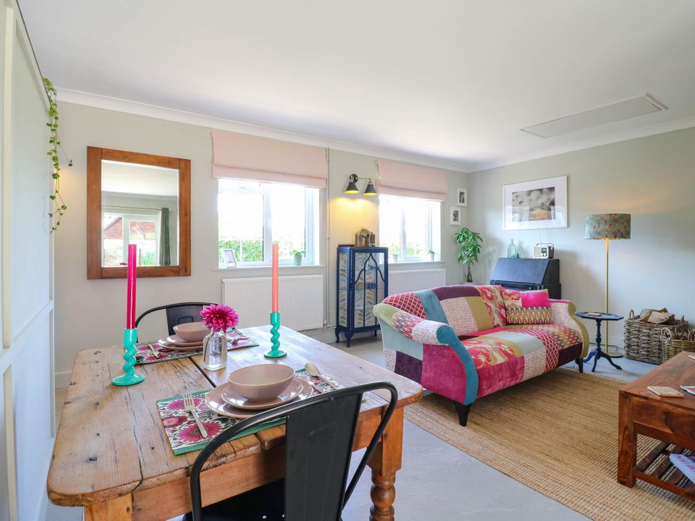 A living room with a table and chairs at The Annexe @ Shotley Cottage Shotley Gate