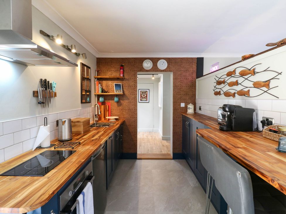 A kitchen featuring a cooking stove and kitchen sink at The Annexe @ Shotley Cottage Shotley Gate
