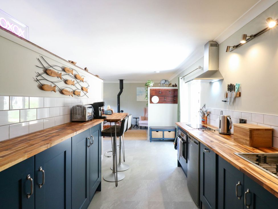 A kitchen with counter and appliances at The Annexe @ Shotley Cottage in Shotley Gate