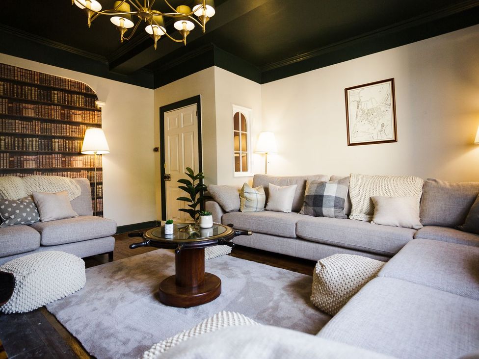 A living room with sofas and a coffee table at Admirals home