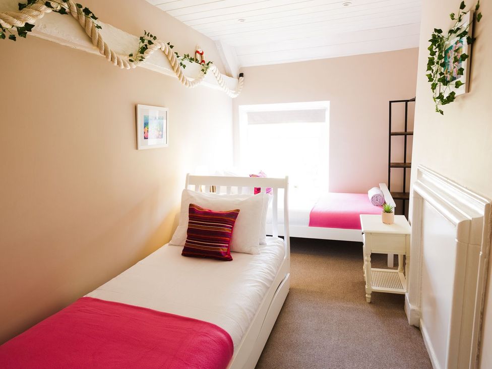 A bedroom with two beds and a window at Admirals home in 