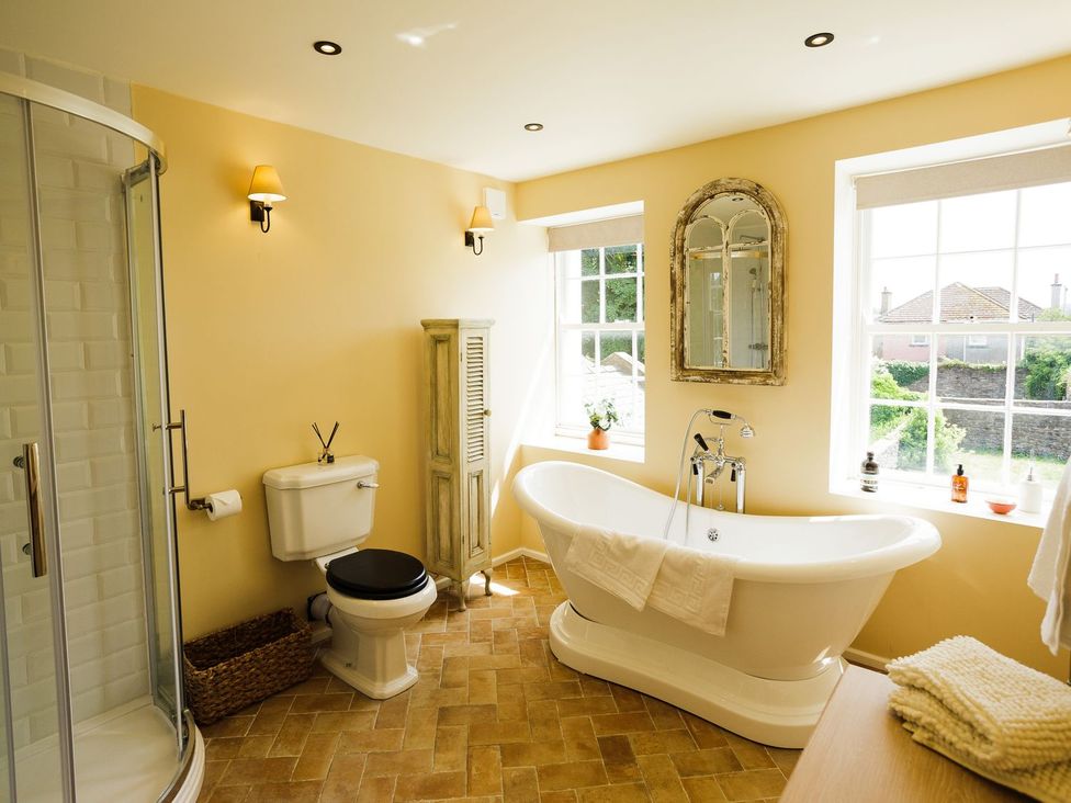 A bathroom with a bathtub and shower at Admirals home in 