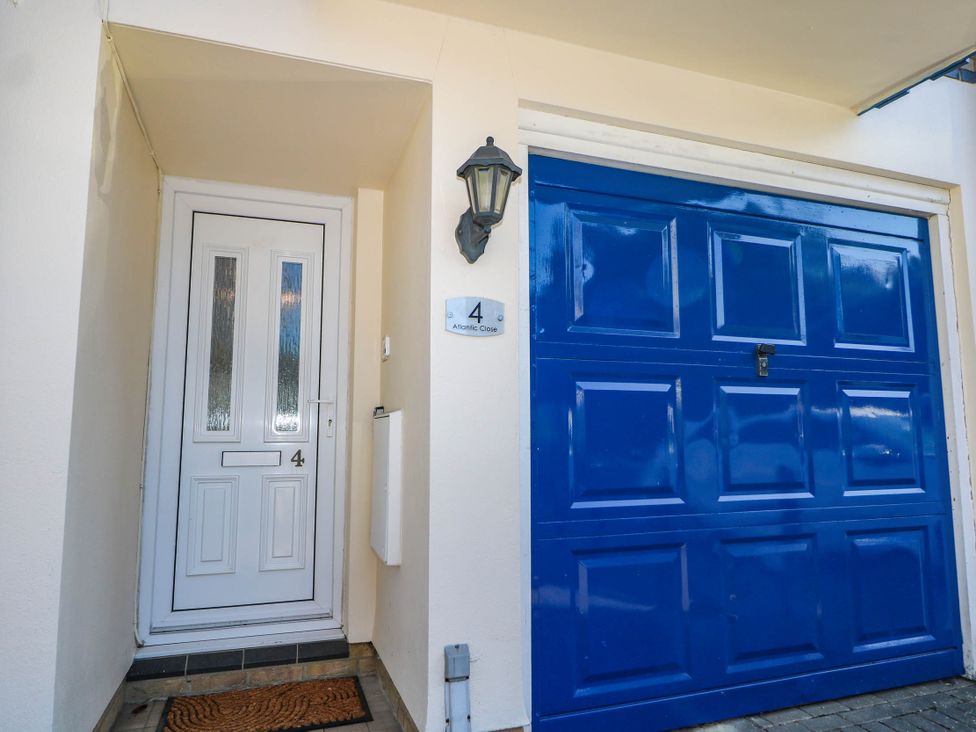 An entrance with a front door and garage door at 4 Atlantic Close in Southampton