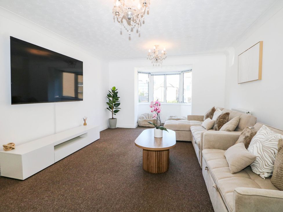 A living room with a sofa and coffee table at 4 Atlantic Close Southampton