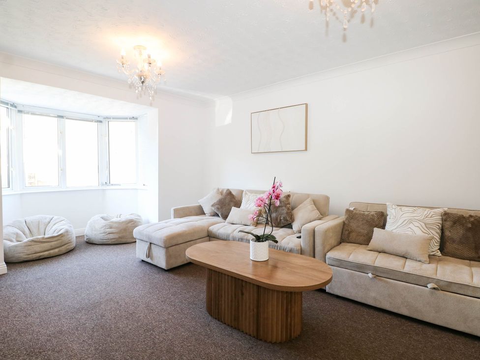 A living room with a sofa and coffee table at 4 Atlantic Close Southampton
