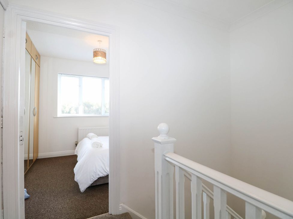 A bedroom with a bed and wardrobe at 4 Atlantic Close, Southampton