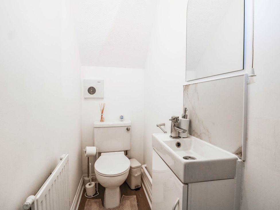 A bathroom with a toilet and sink at 4 Atlantic Close Southampton