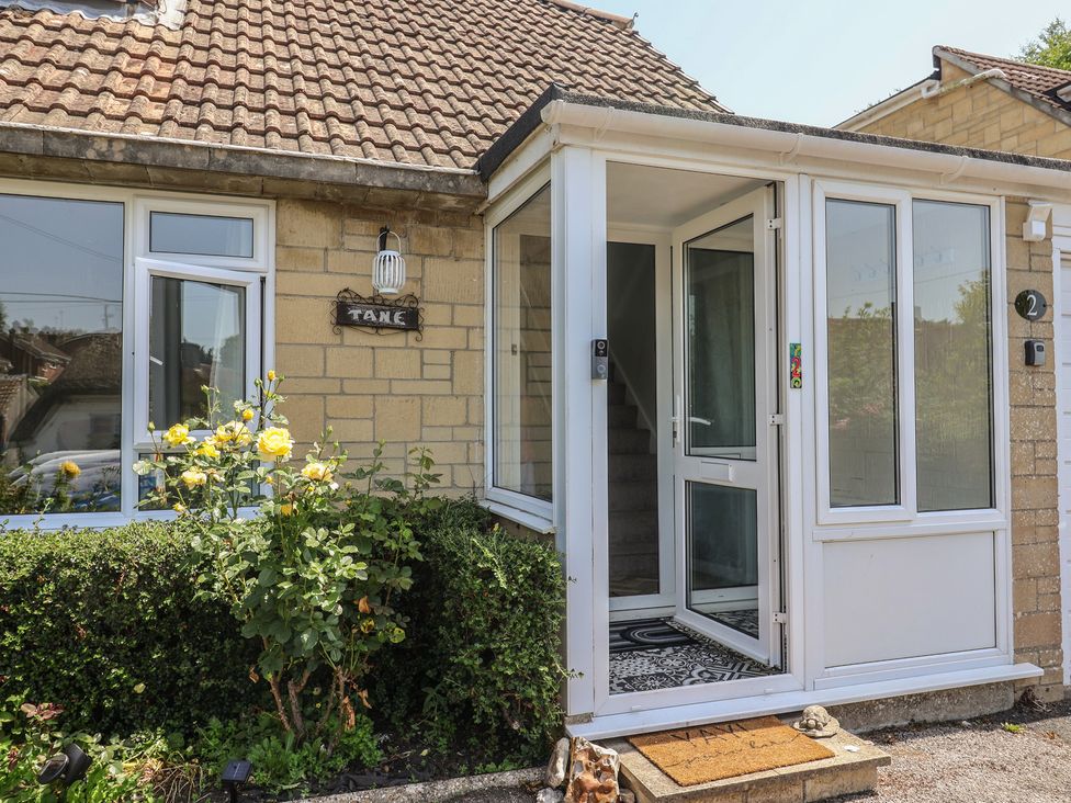 An entrance with a door and steps at Tane in Winterborne Stickland