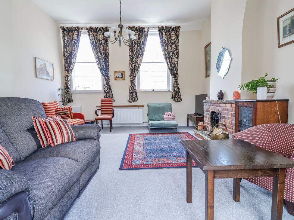 A living room with a sofa and armchairs at Top floor apartment