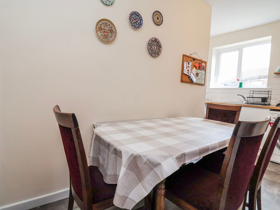 A dining room with a table and chairs at Top floor apartment