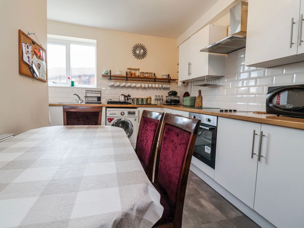 A kitchen with a table and chairs at Top floor apartment