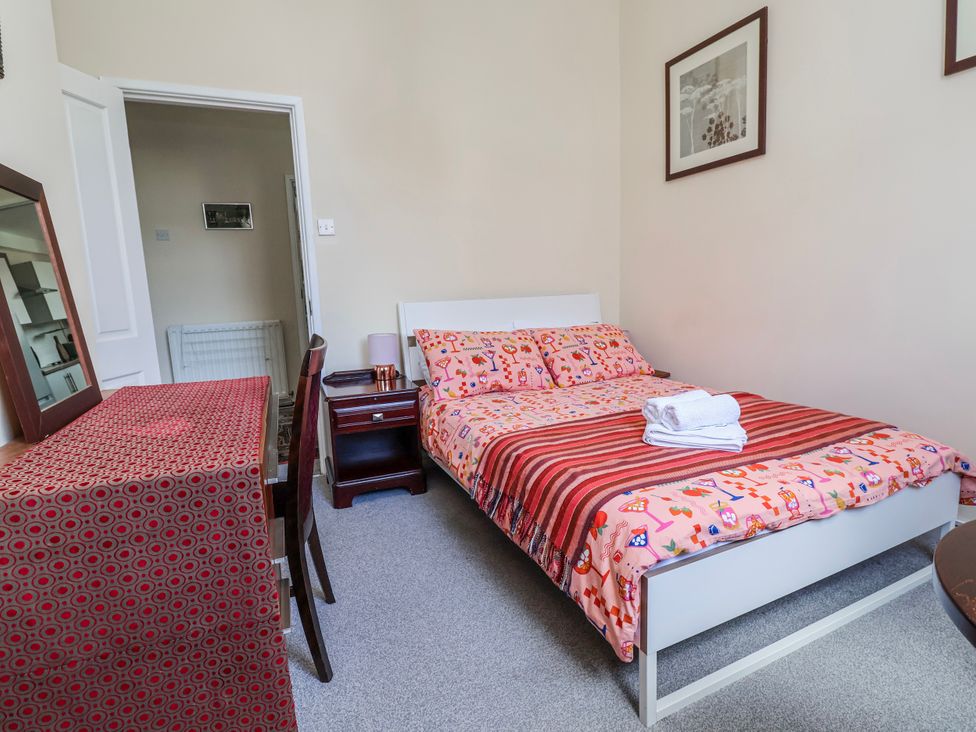 A bedroom with a bed and a table at Top floor apartment 