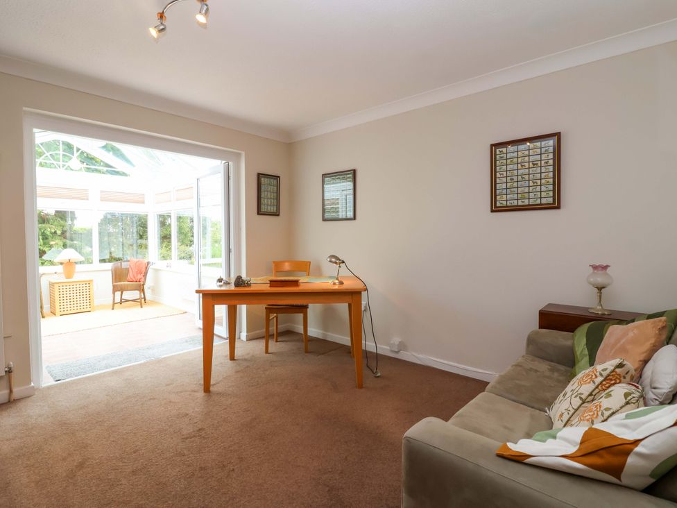 A snug with a table and chair at 26 Five Bells in Watchet