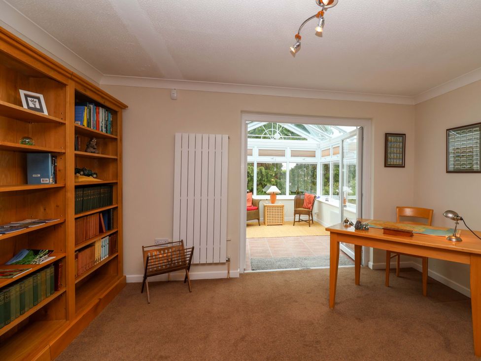 A home office with a desk and chair at 26 Five Bells Watchet