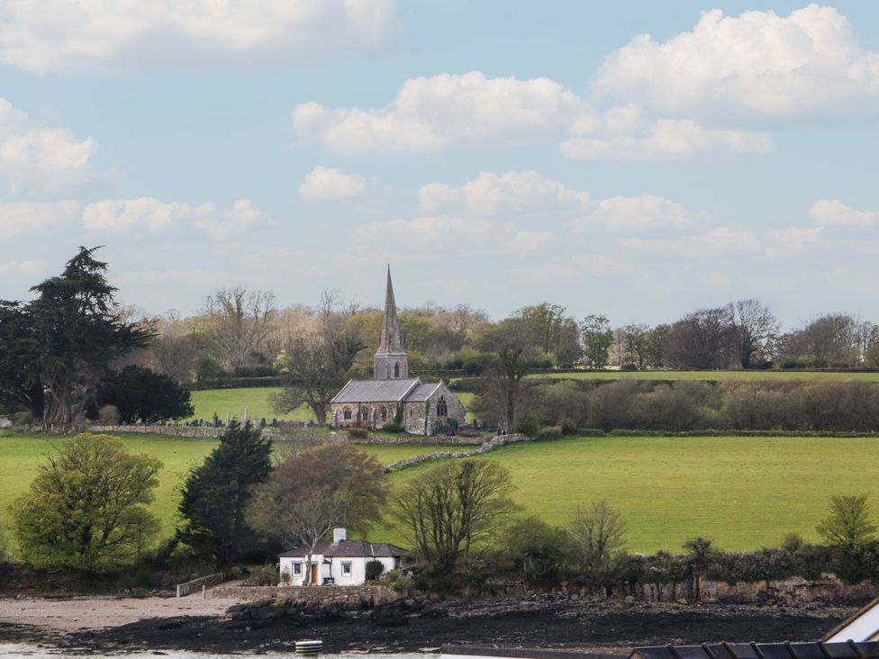 A church and house in a field at Seaview in Y Felinheli